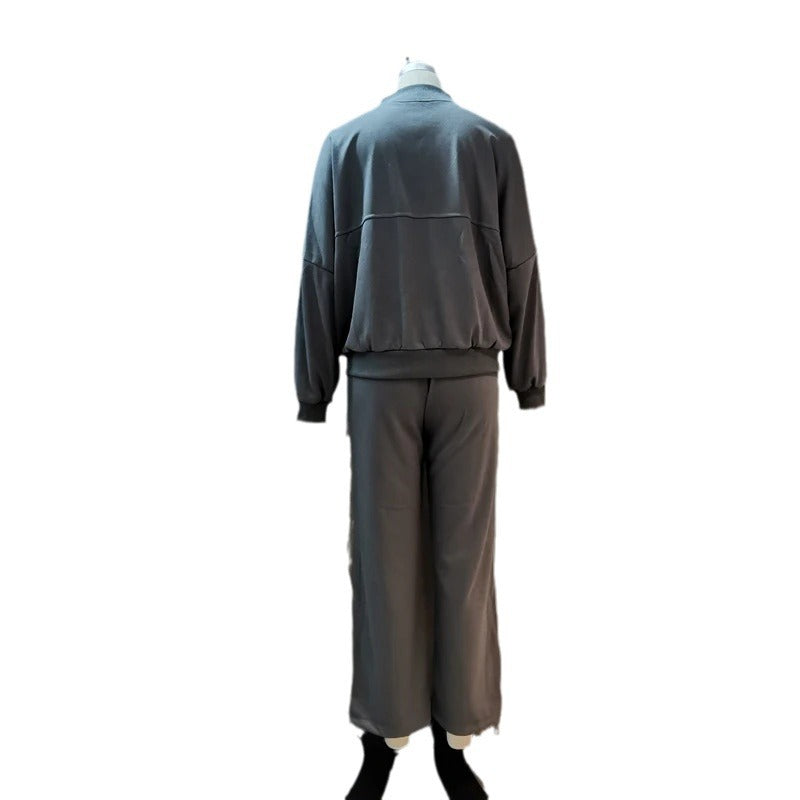 Completo casual di pantaloni e felpa con zip tinta unita