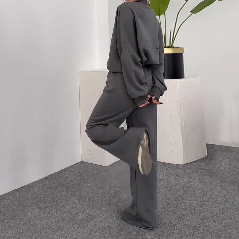 Completo casual di pantaloni e felpa con zip tinta unita