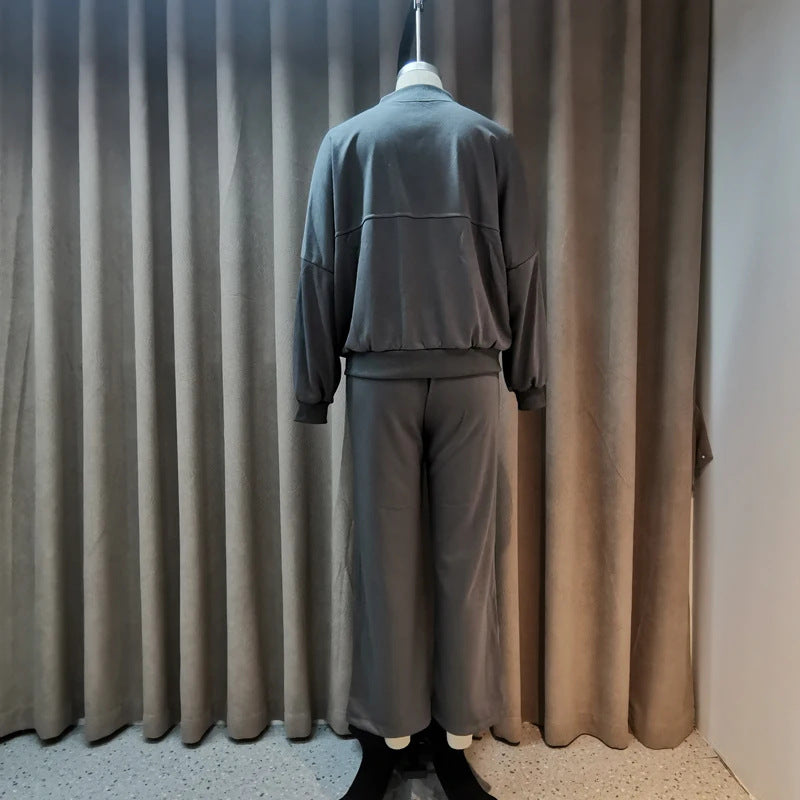 Completo casual di pantaloni e felpa con zip tinta unita